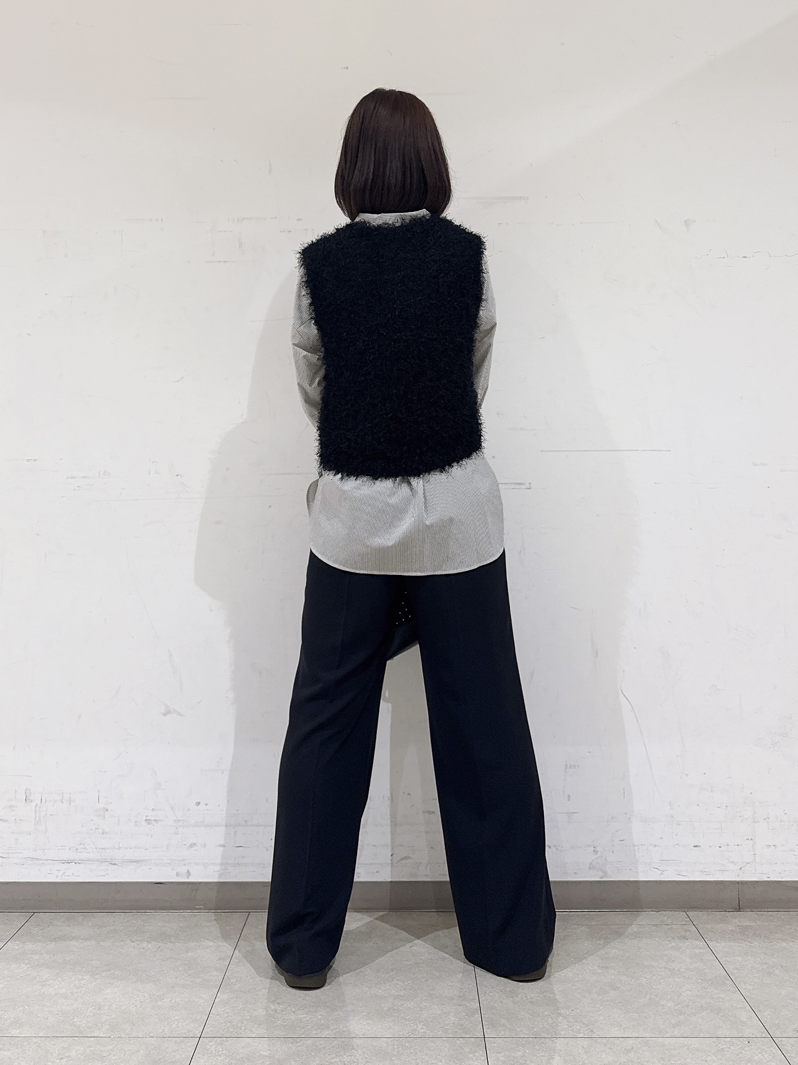 rinaさんの「INDIVI｜【洗える】ファンシーヤーンVネックニットベスト」を使ったコーディネート